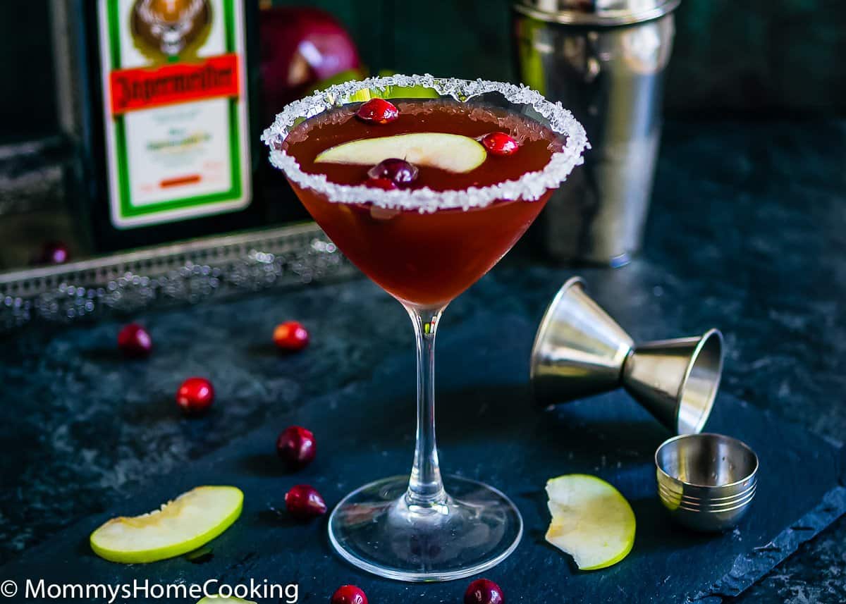 Apple Fall Cocktail in a sugar rimmed glass with a slice of green apple on top