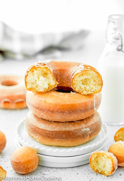 a stack of eggless fluffy donuts in a plate