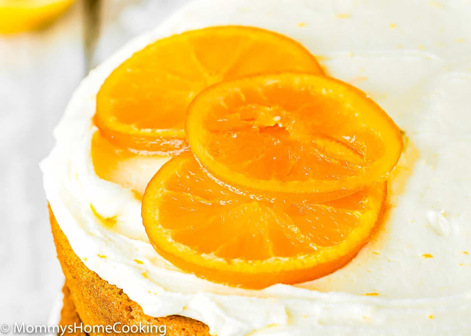 candied orange slices over a egg-free cake. 