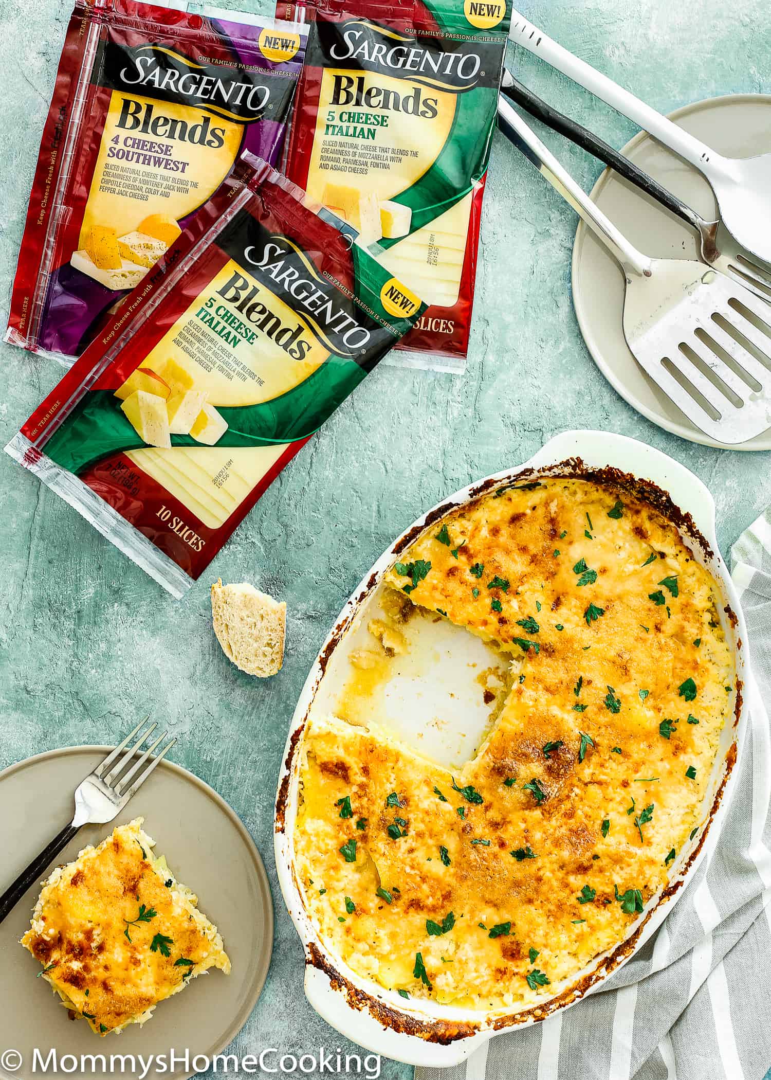 This Cheesy Potatoes and Cod Casserole recipe is cheesy, creamy, and easy to make! Loaded Potato, cheese and cod, this dish is a whole dinner in one! For sure a go-to dinner for any day of the week. https://mommyshomecooking.com