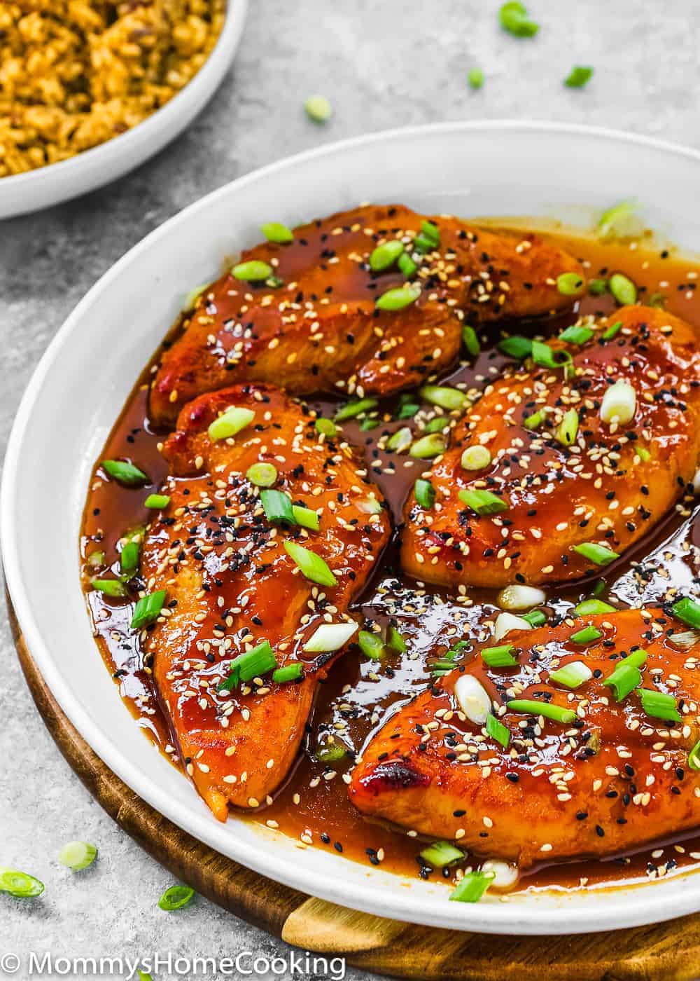 Easy Asian-Style Chicken Breasts in a white skillet 