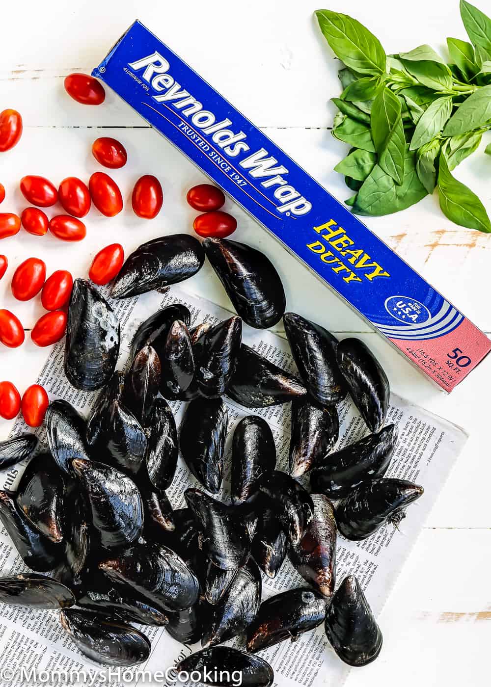 fresh mussels, tomatoes and a roll of foil