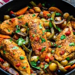 Easy Chicken Breasts Cacciatore in a cast iron skillet with veggies