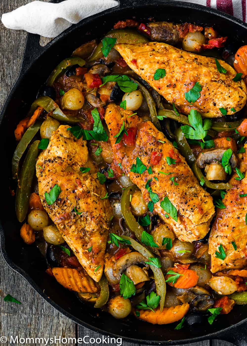 Easy Chicken Cacciatore with veggies  in a cast iron skillet