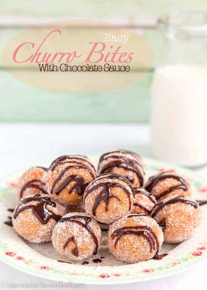 Easy Churro Bites with Chocolate Sauce in a plate with a glass of milk