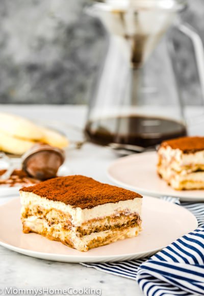 a slice of eggless tiramisu on a plate.