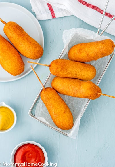 overhead of eggless corndogs in a frying basket