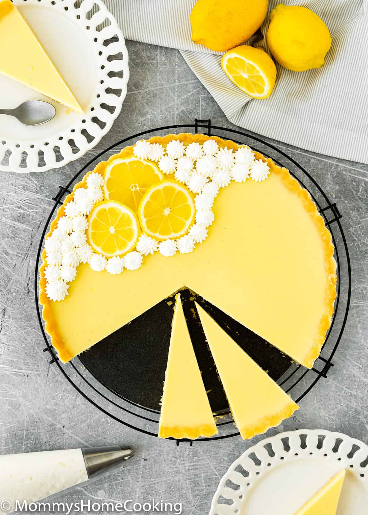 a sliced Eggless lemon tart over a round wired rack. 