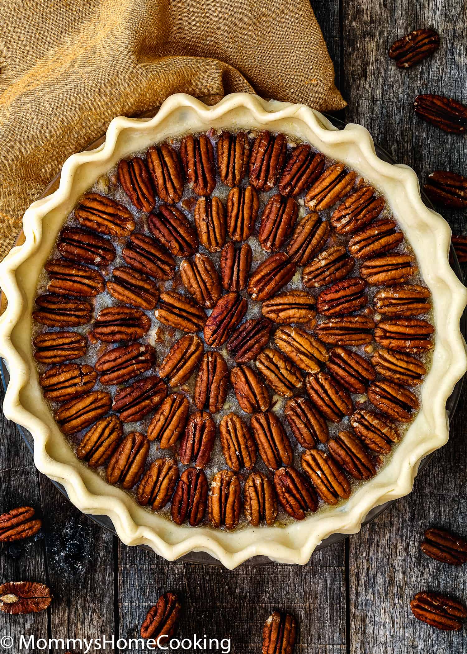 unbaked Eggless Pecan Pie in a pie dish. 