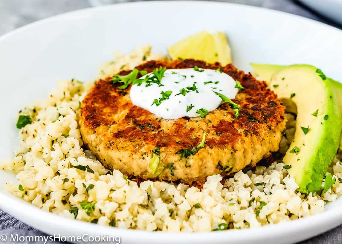 Plate with Eggless Salmon Patties, Cauliflower rice and avocado.