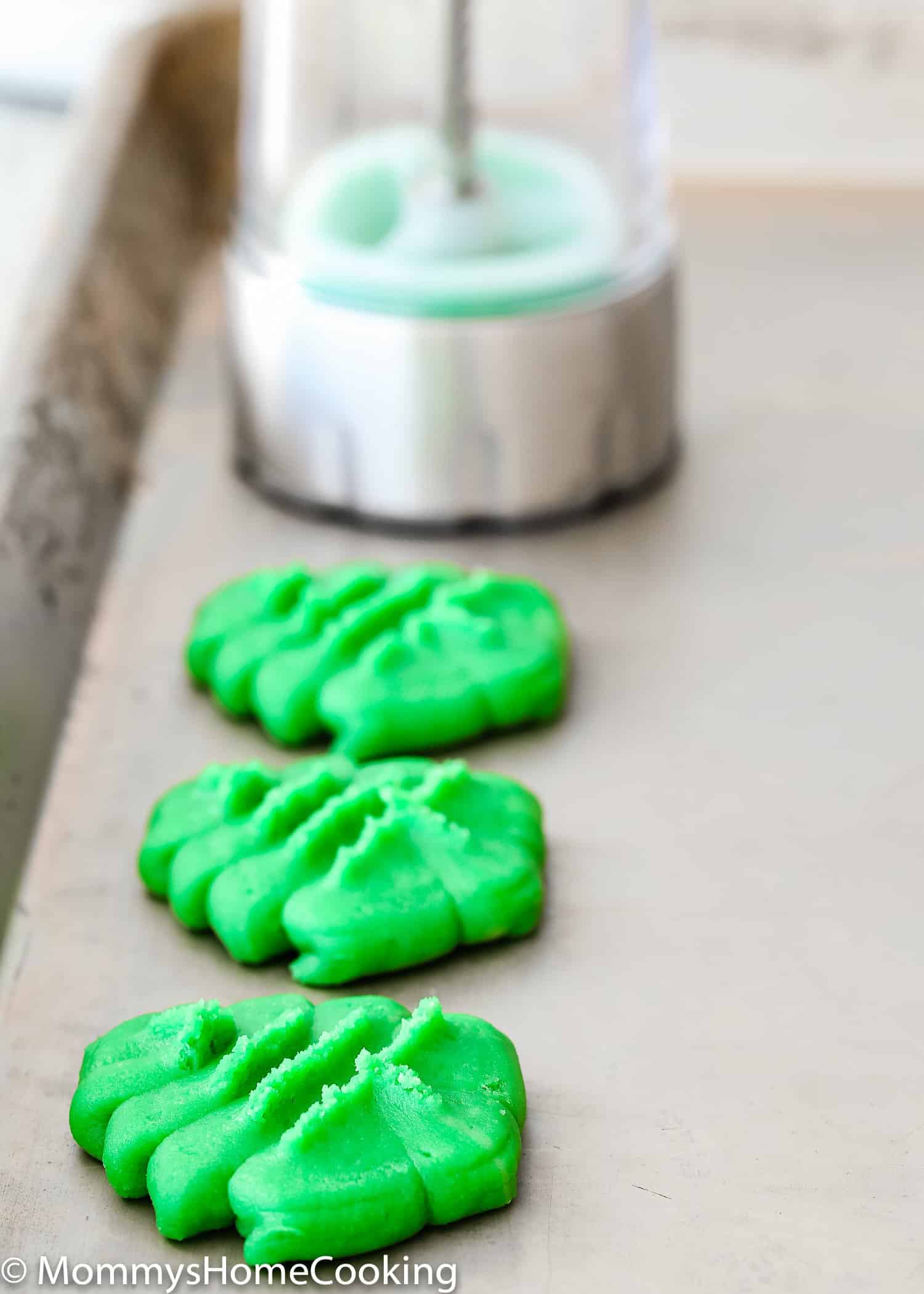 unbaked Eggless Spritz Cookies on a baking sheet. 