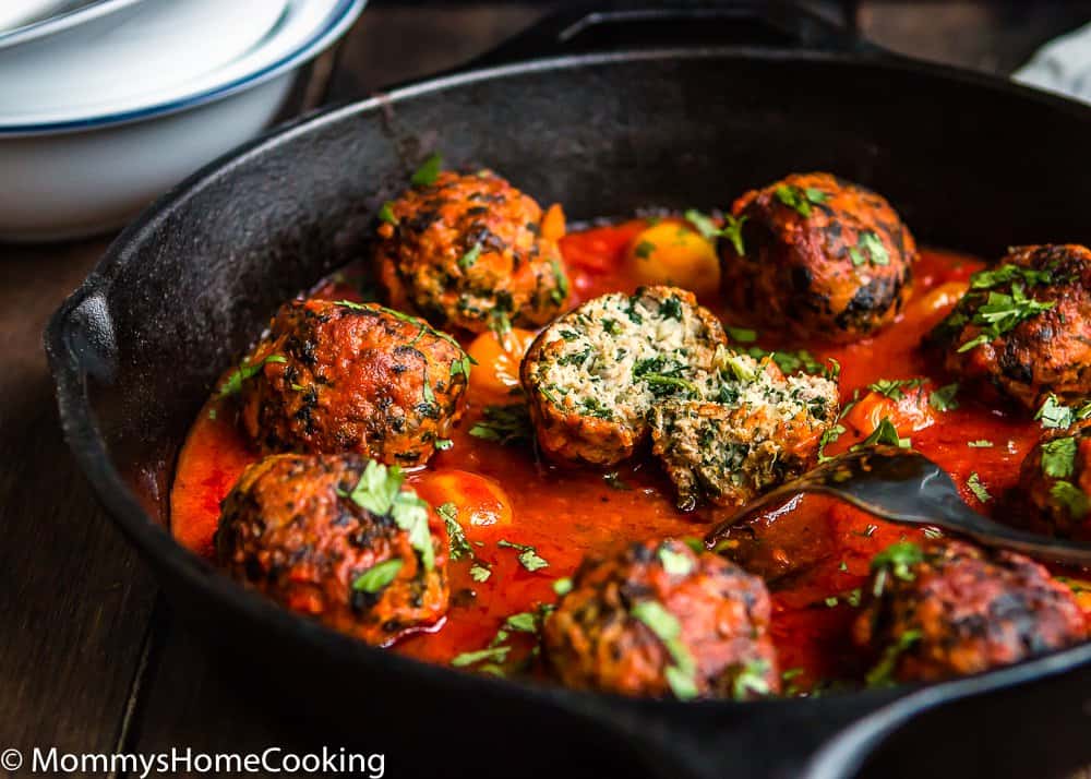 Juicy Eggless turkey meat balls in a cast iron skillet.