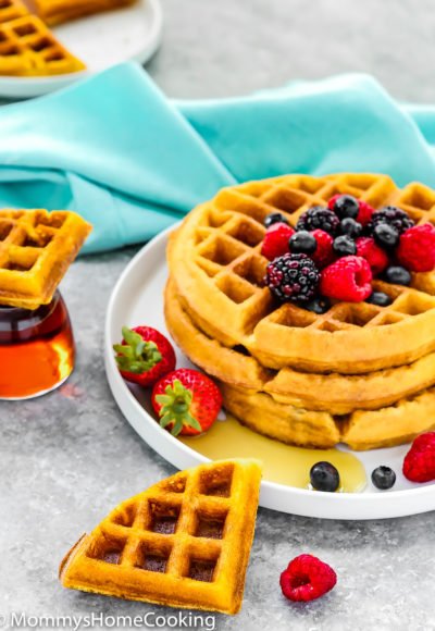 eggless waffles stack with fresh fruit on a gray surface