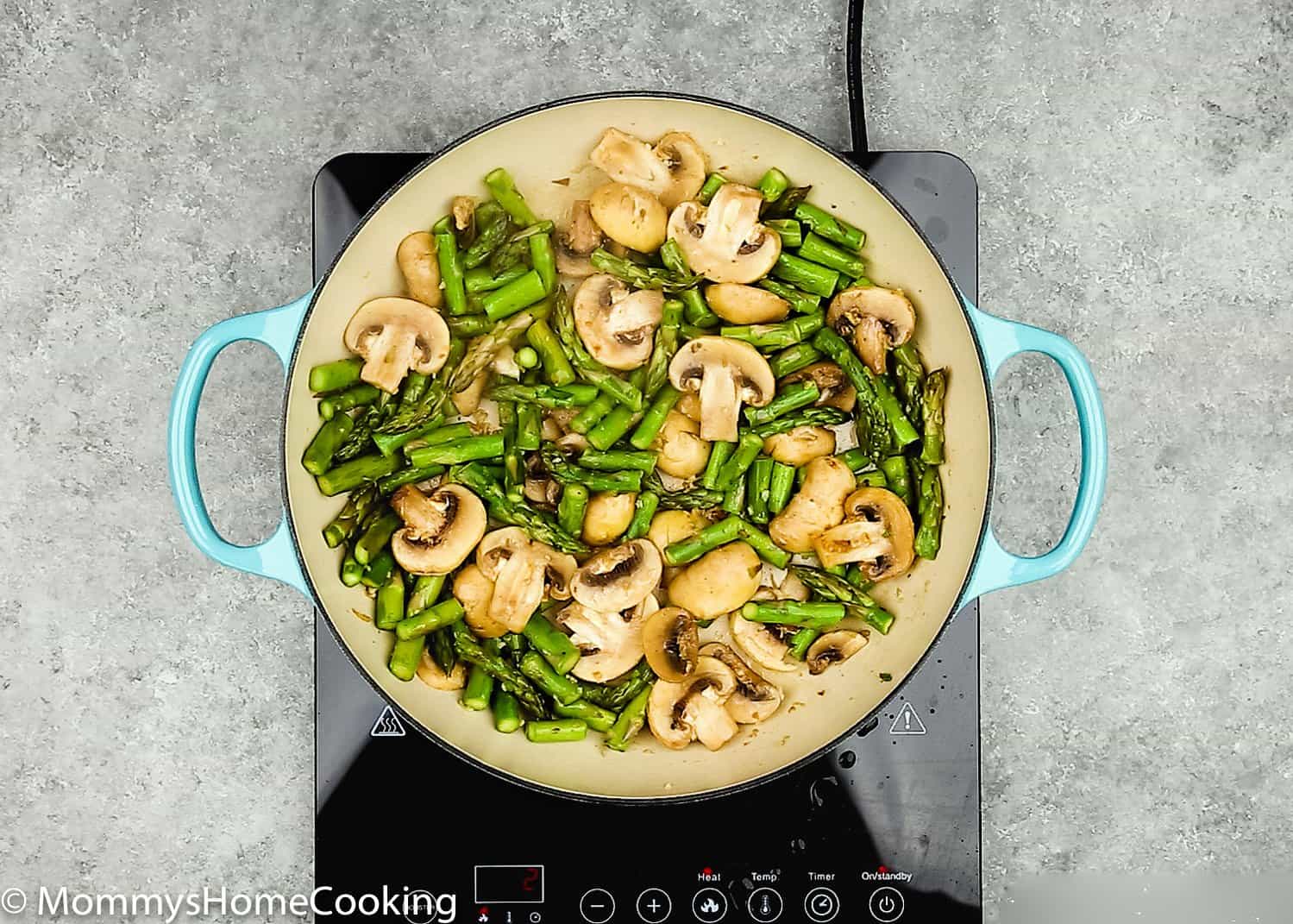 mushrooms and asparagus in a skillet