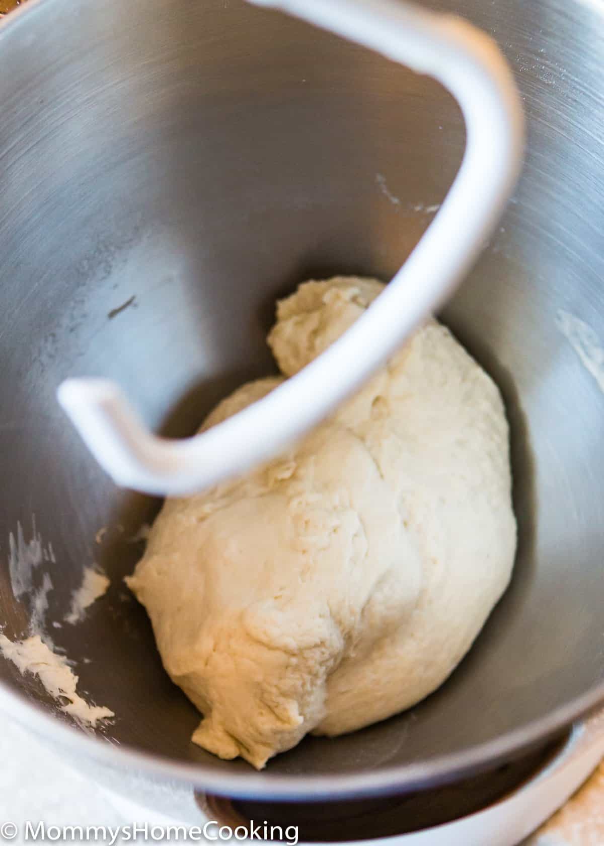 pizza dough in a bowl of a stand mixer.