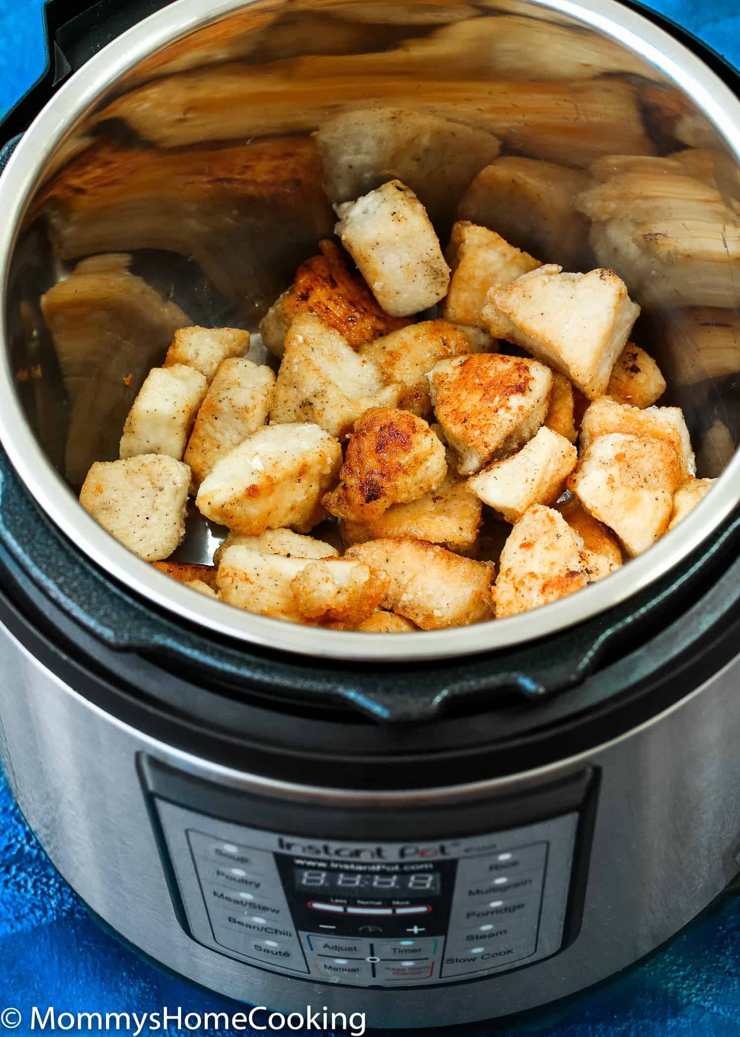browned chicken in a pressure cooker pot