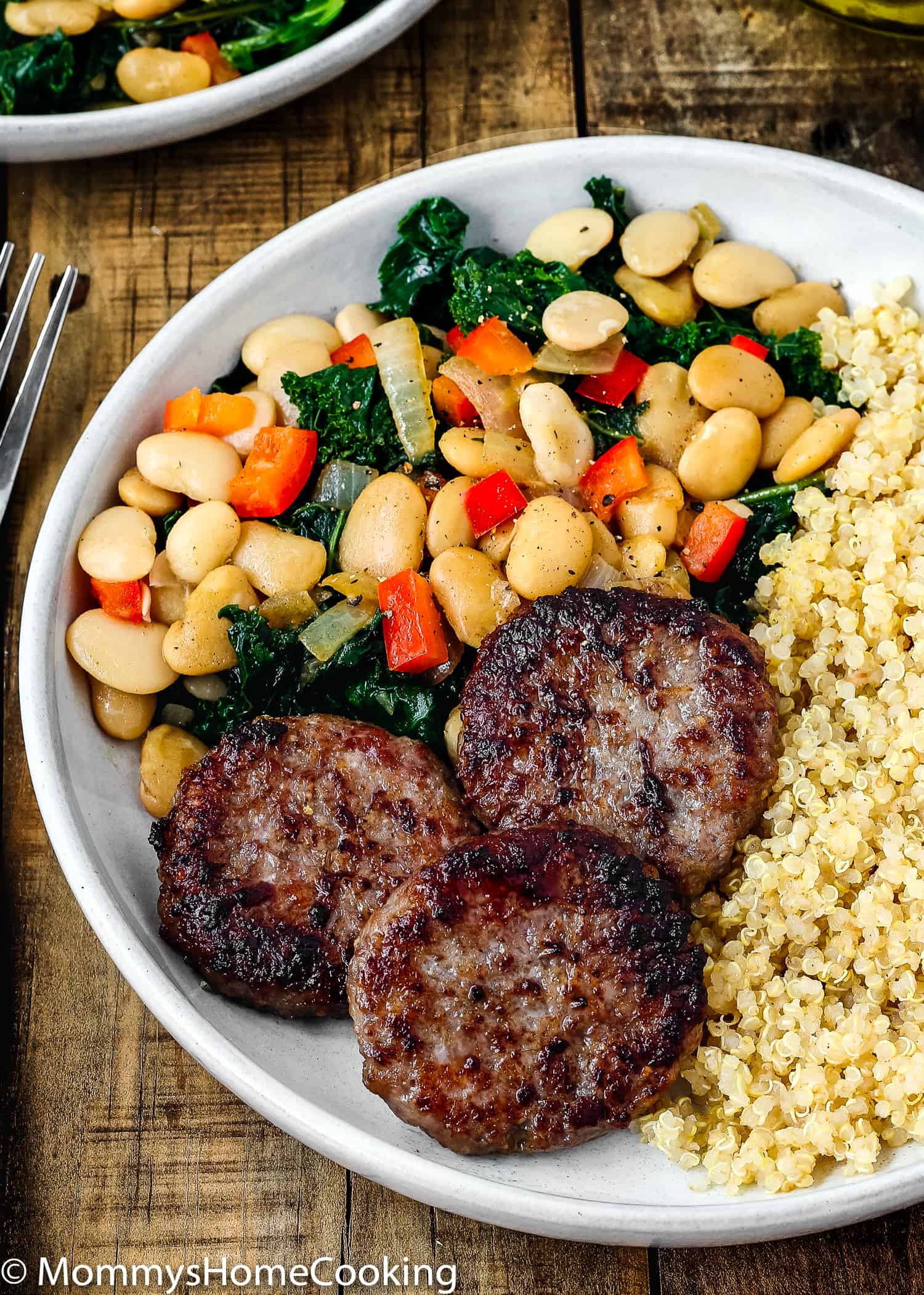 This Easy Sausage and Bean Quinoa Bowl is a delicious way to bring breakfast to the dinner table! Made with breakfast sausage, quinoa, beans, kale and veggies, this satisfying meal comes together in no time! https://mommyshomecooking.com