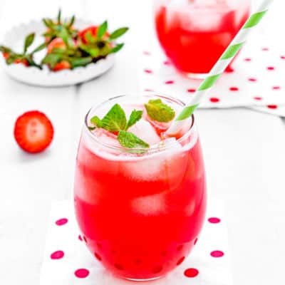 homemade Strawberry lemonade in a glass with a straw