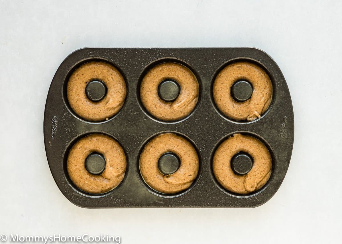 donut pan filled with Eggless Apple Cider Donuts batter