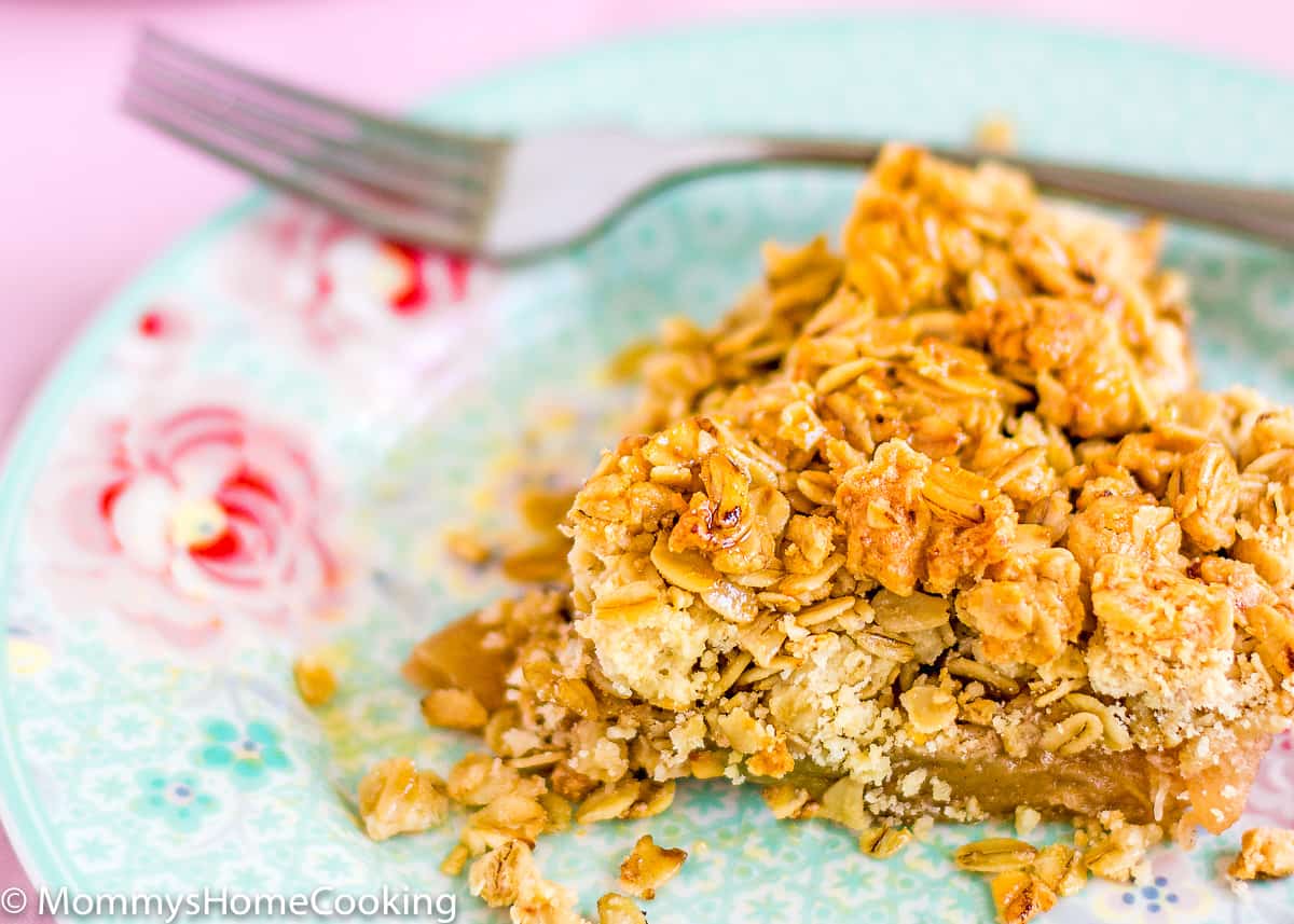 Eggless Apple Crumble with Oats on a plate with a fork in the background