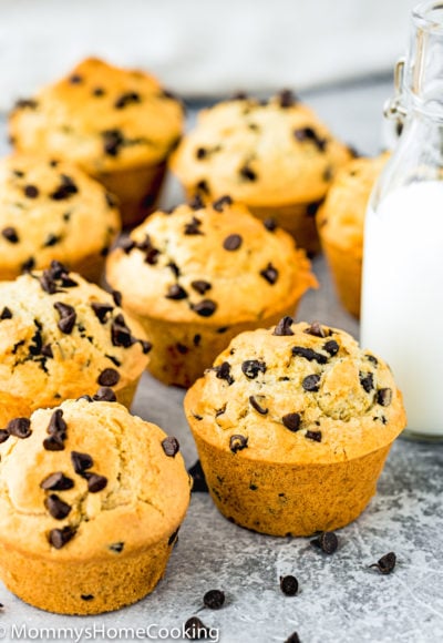 Eggless Bakery-Style Chocolate Chip Muffins over a gray surface