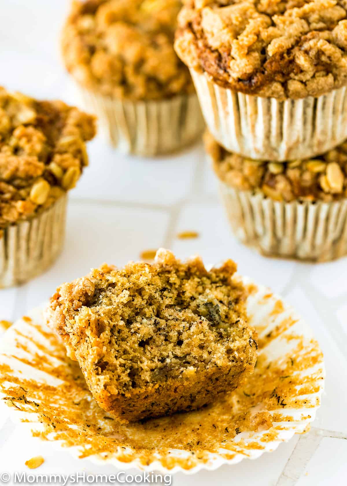 an egg-free banana crumb muffin cut open showing its inside texture. 