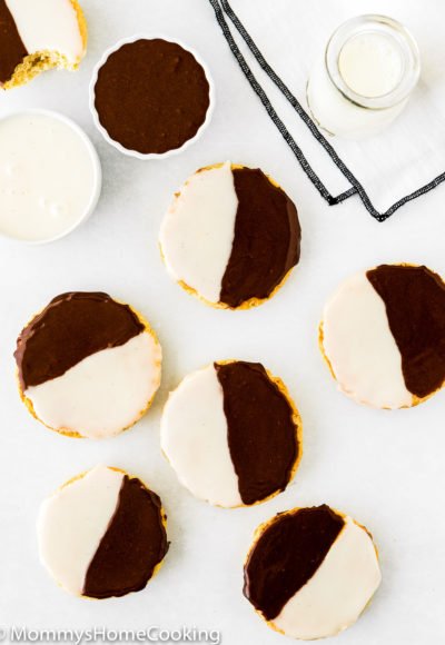 overhead view of Black and White Cookies over a white surface