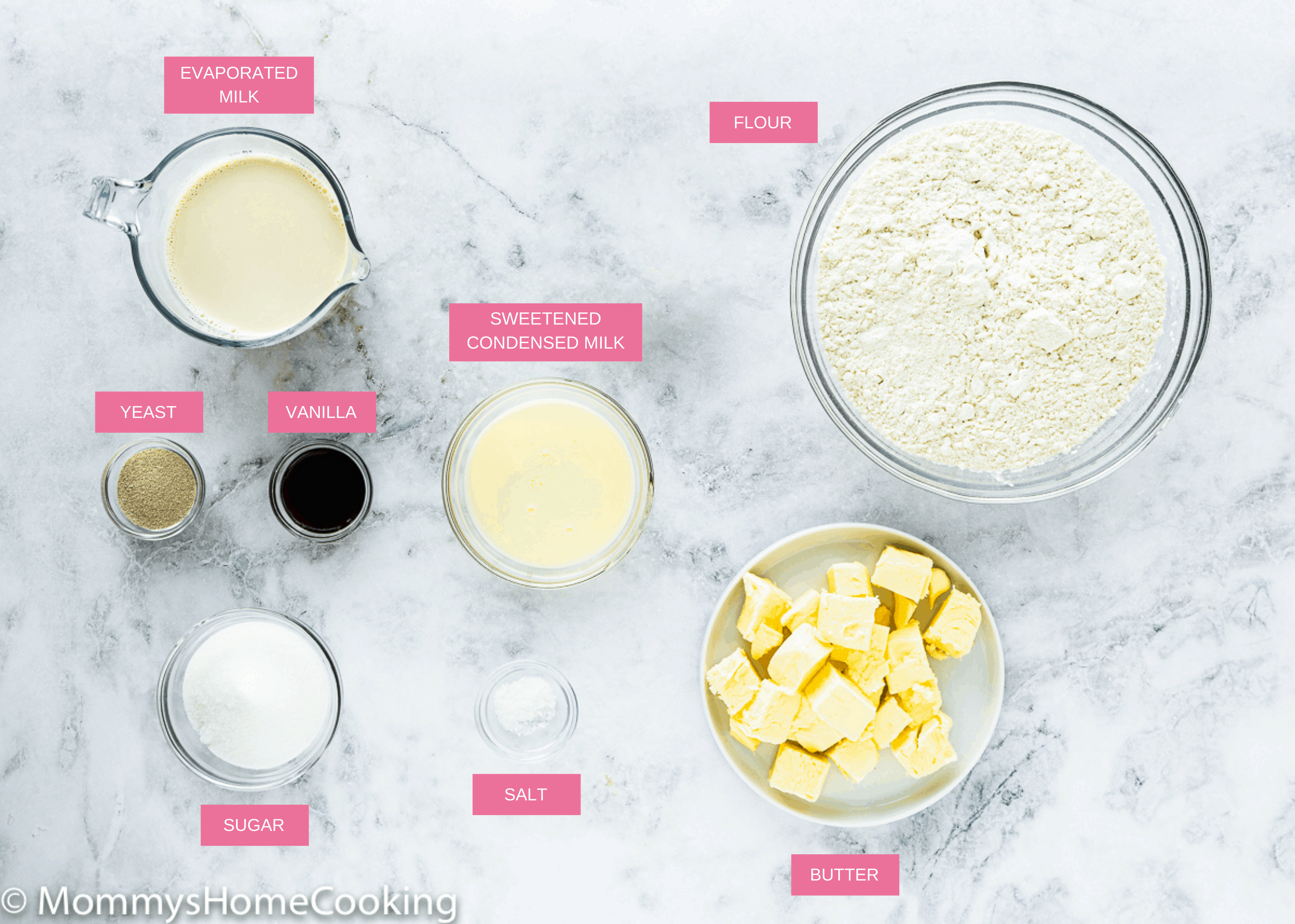 eggless brioche bread ingredients over a marble surface with name tags. 