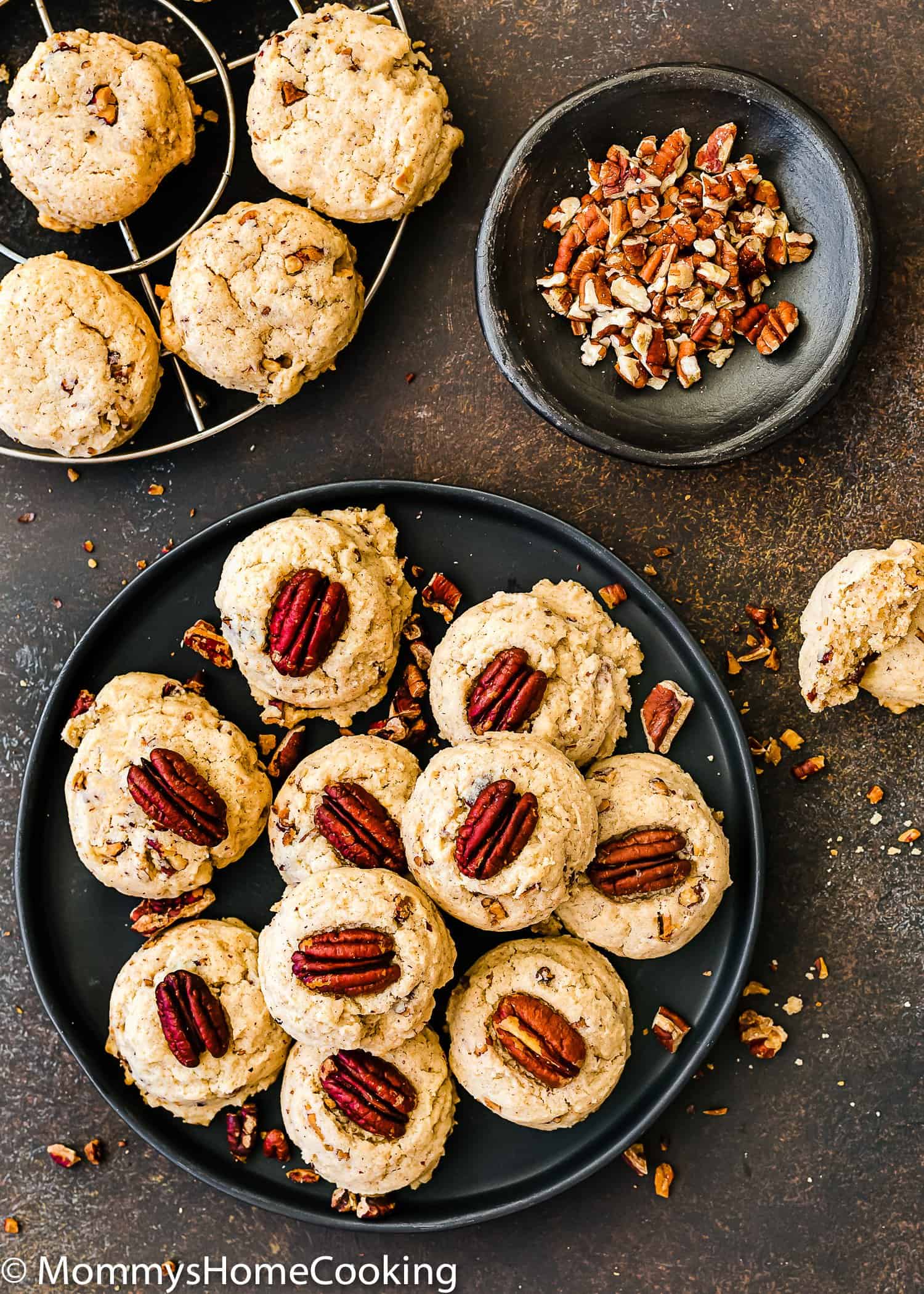 overhead view of Eggless Butter Pecan Cookies over a black plate