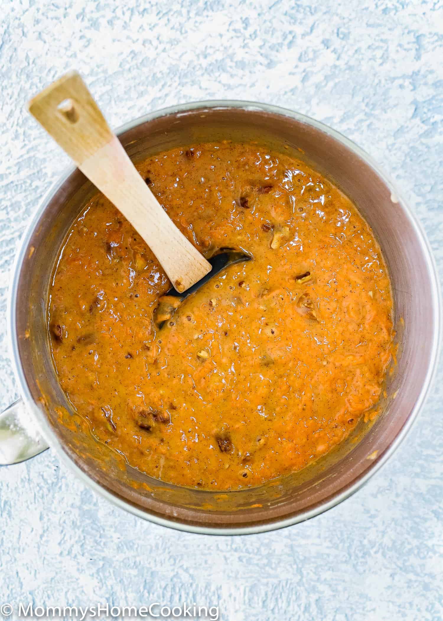 eggless carrot cake batter in a bowl with a spatula