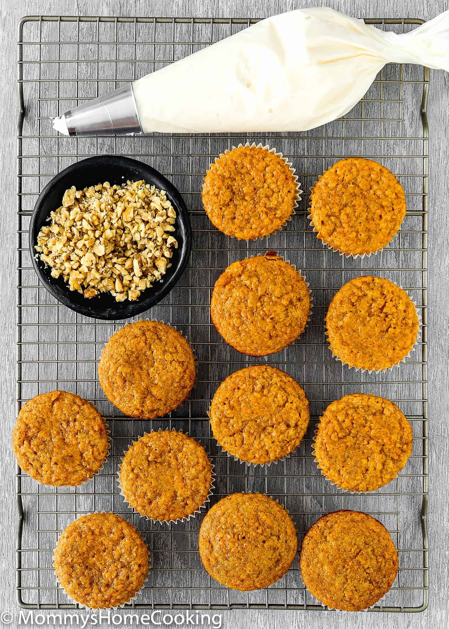 Eggless Carrot Cake Cupcakes over a cooling rack.