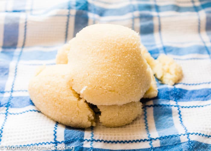 Cauliflower rice to make pizza crust over a blue kitchen towel