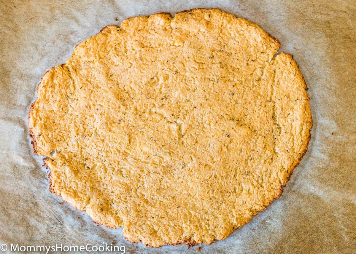 Eggless Cauliflower Pizza crust over a parchment paper