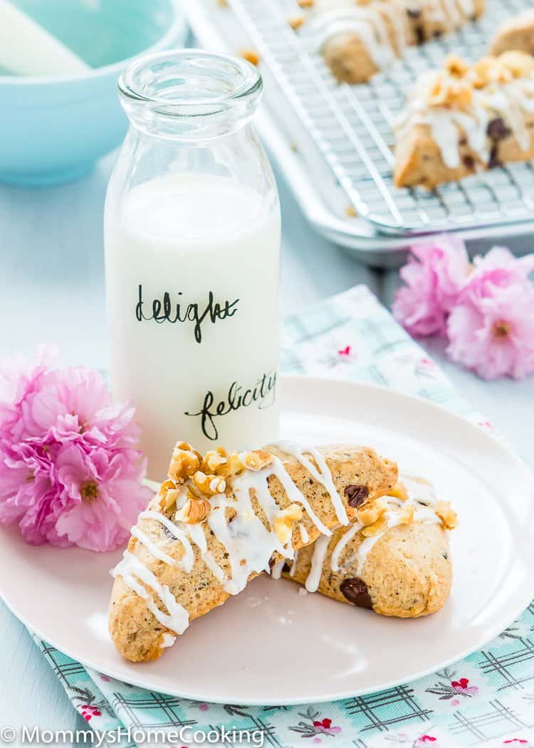 two Eggless Chocolate Chip Scone in a plate with a glass of milk