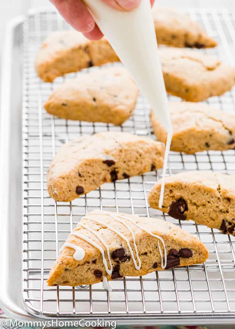 Eggless Chocolate Chip Scone being glazed