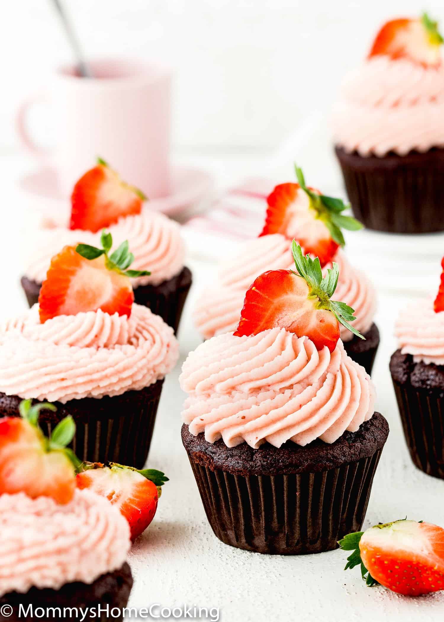 Eggless Chocolate Strawberry Cupcakes with strawberry buttercream and fresh strawberries.