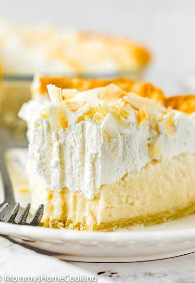 Eggless Coconut Cream Pie slice on a plate showing creamy texture