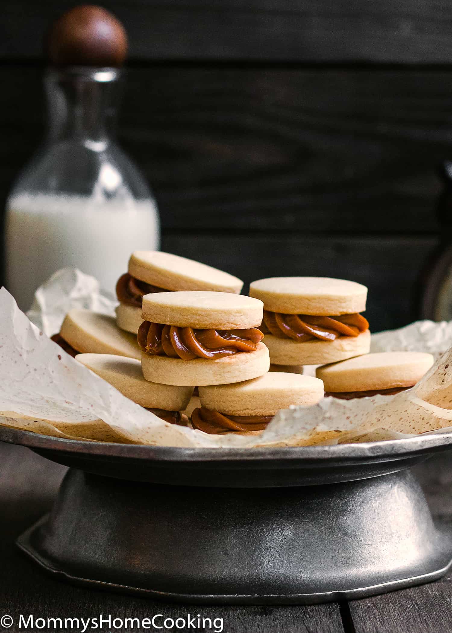 What is better than a cookie? A Sandwich Cookie!! These Eggless Dulce de Leche Shortbread Sandwich Cookies are buttery, rich incredibly tender and delicious. 9 filling ideas included. https://mommyshomecooking.com