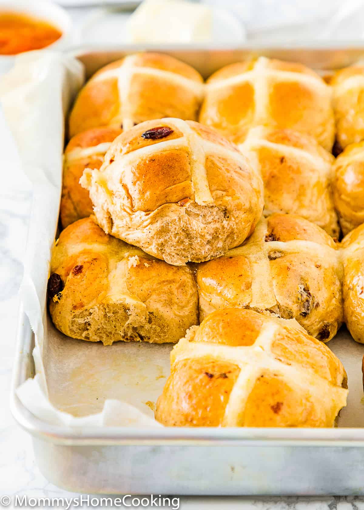 baked egg free Eggless Easter Hot Cross Buns in a baking tray 