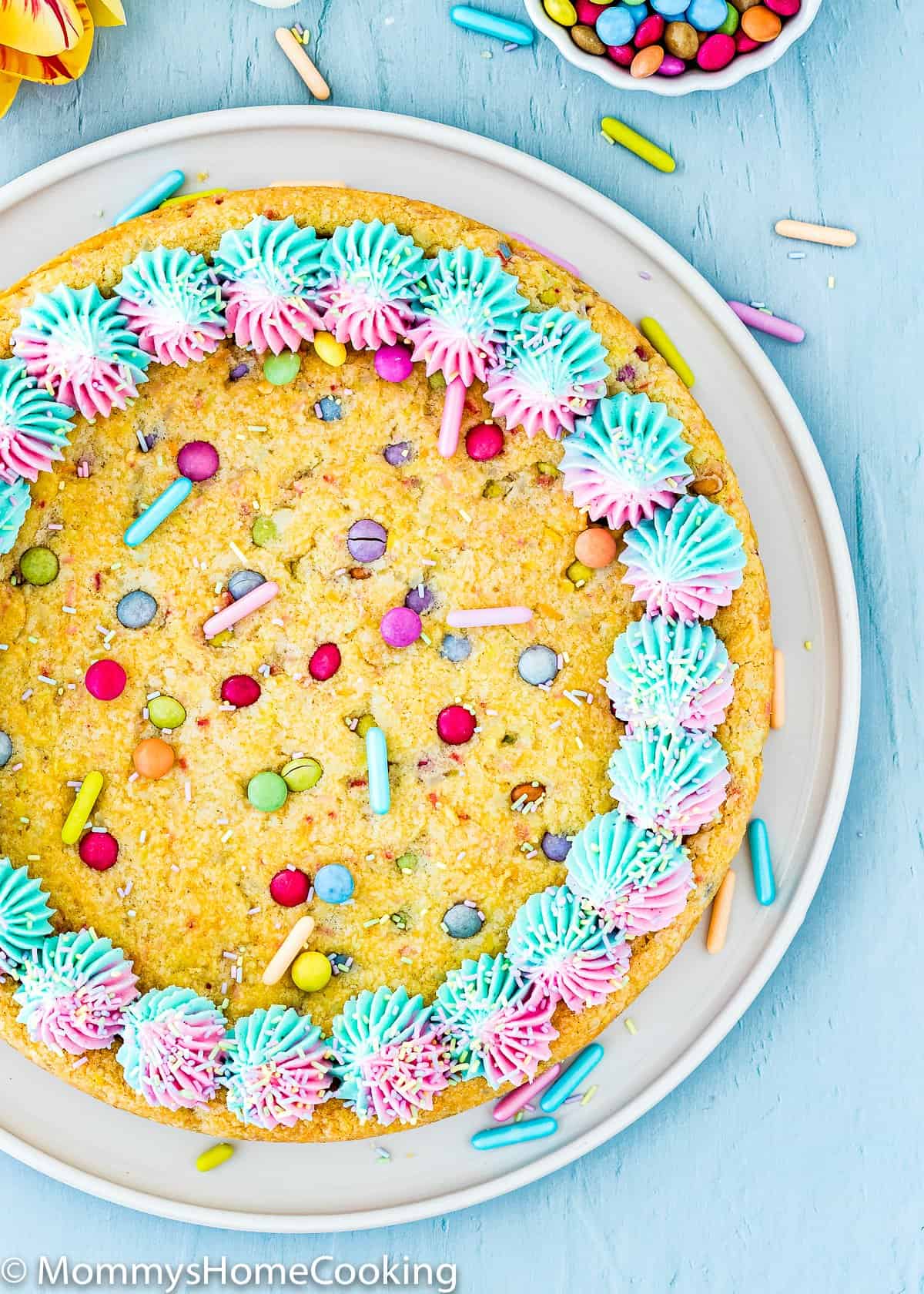 a whole Eggless Easter Sugar Cookie Cake decorated with buttercream and sprinkles