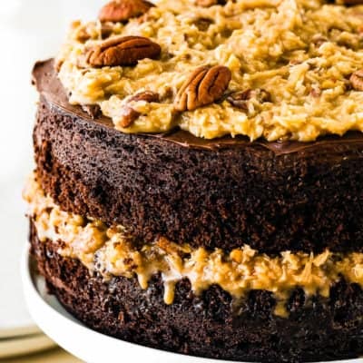 Eggless German Chocolate Cake in a cake stand closeup