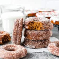 Eggless Gingerbread Donuts stack with a glass of milk