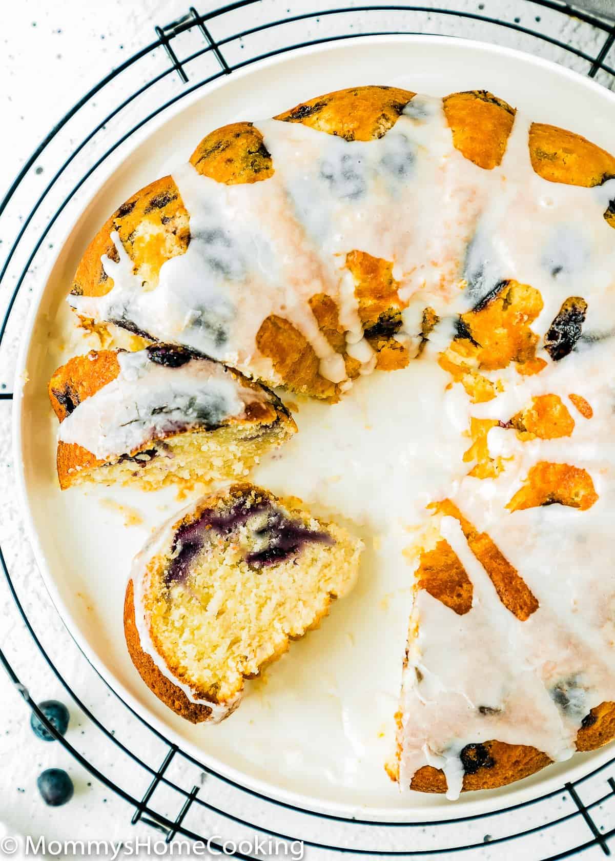 Eggless Lemon Blueberry bundt Cake sliced on a plate