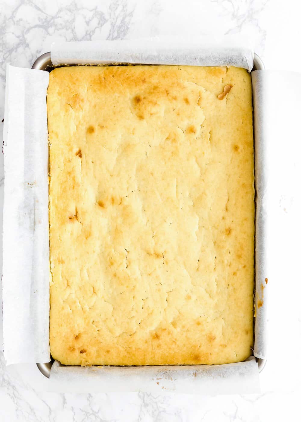 baked Eggless Lemon Cake in a rectangular cake pan