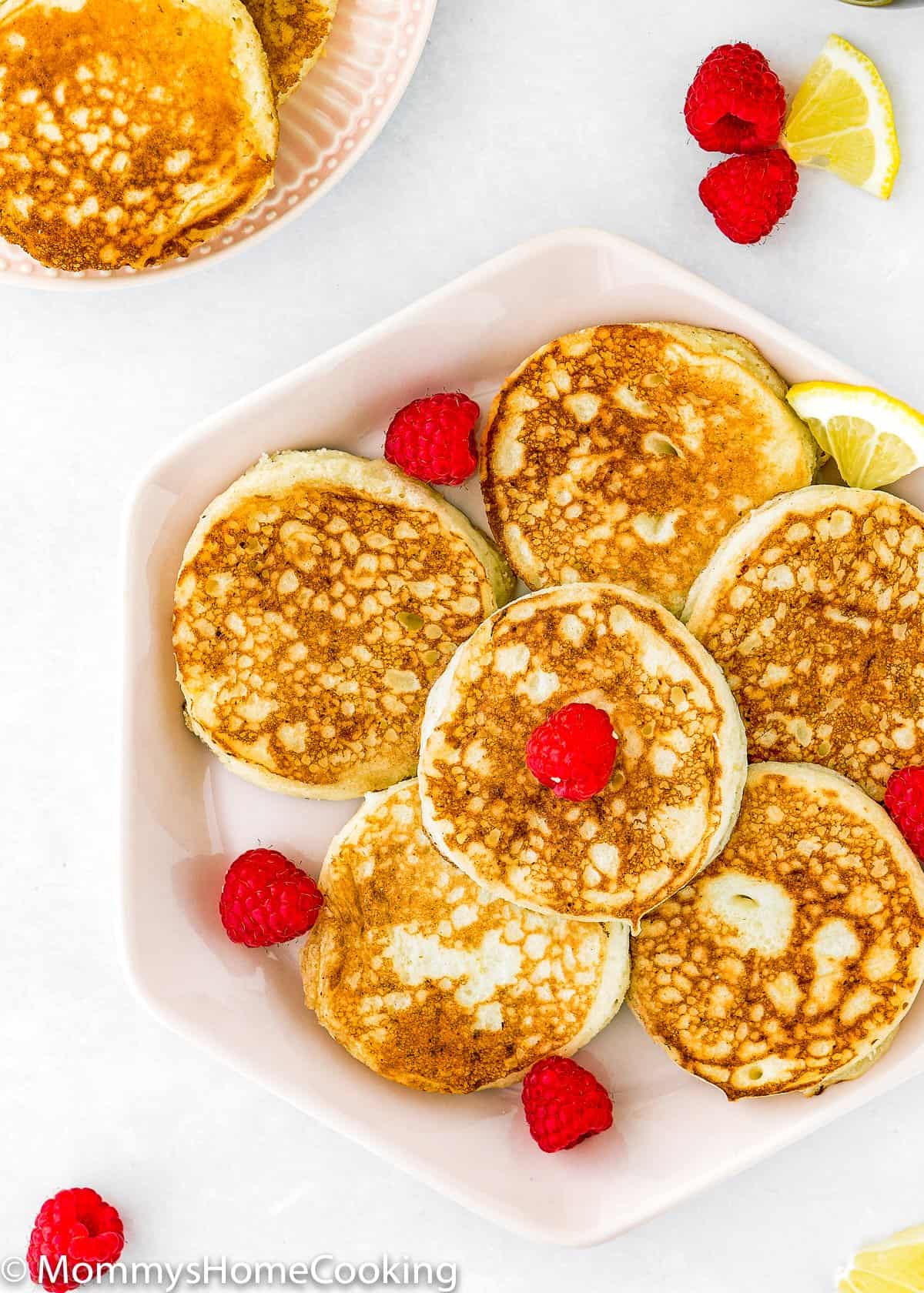 overhead view of a plate with eggless lemon ricotta pancakes.