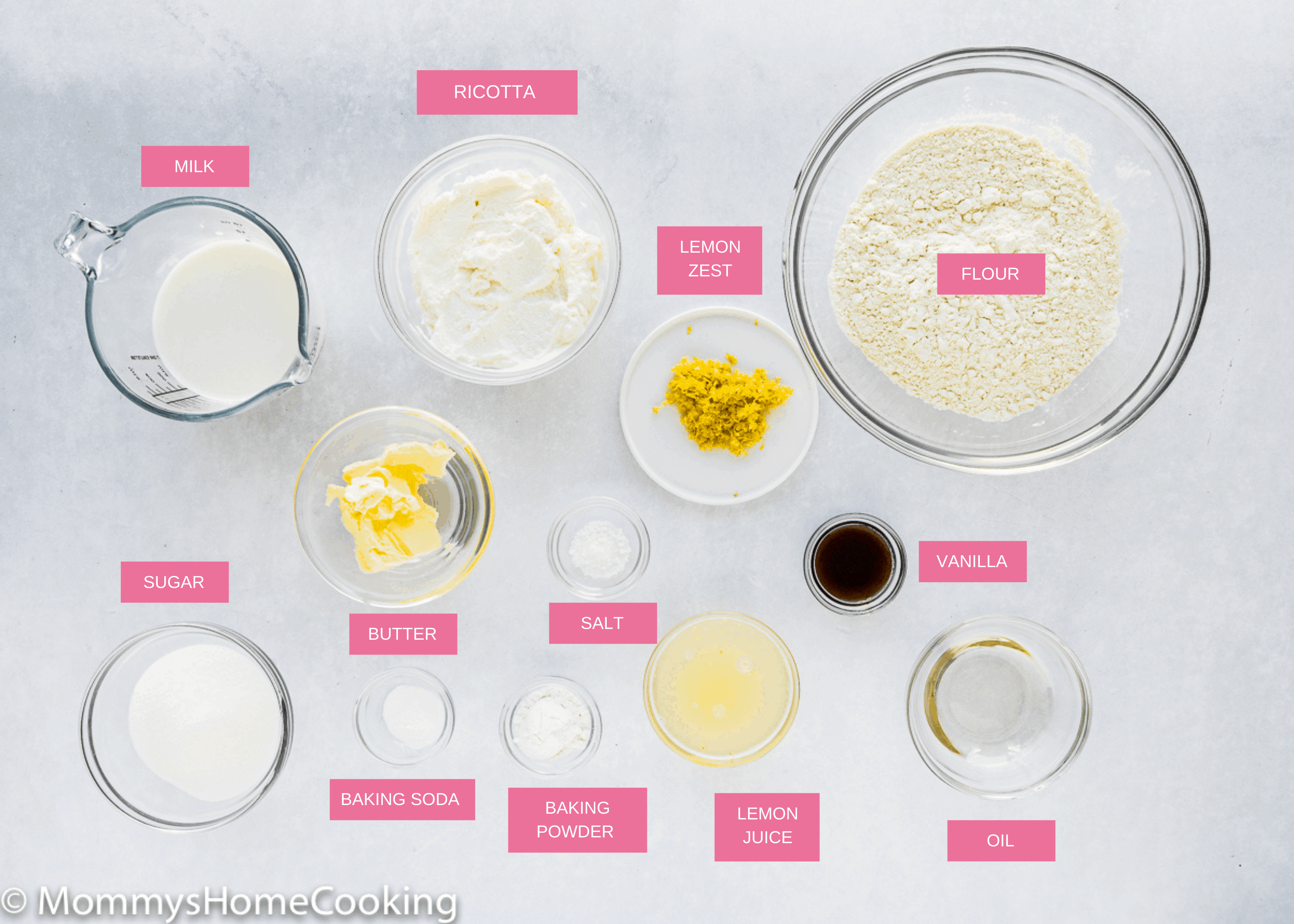 eggless lemon ricotta pancakes ingredients over a gray surface.