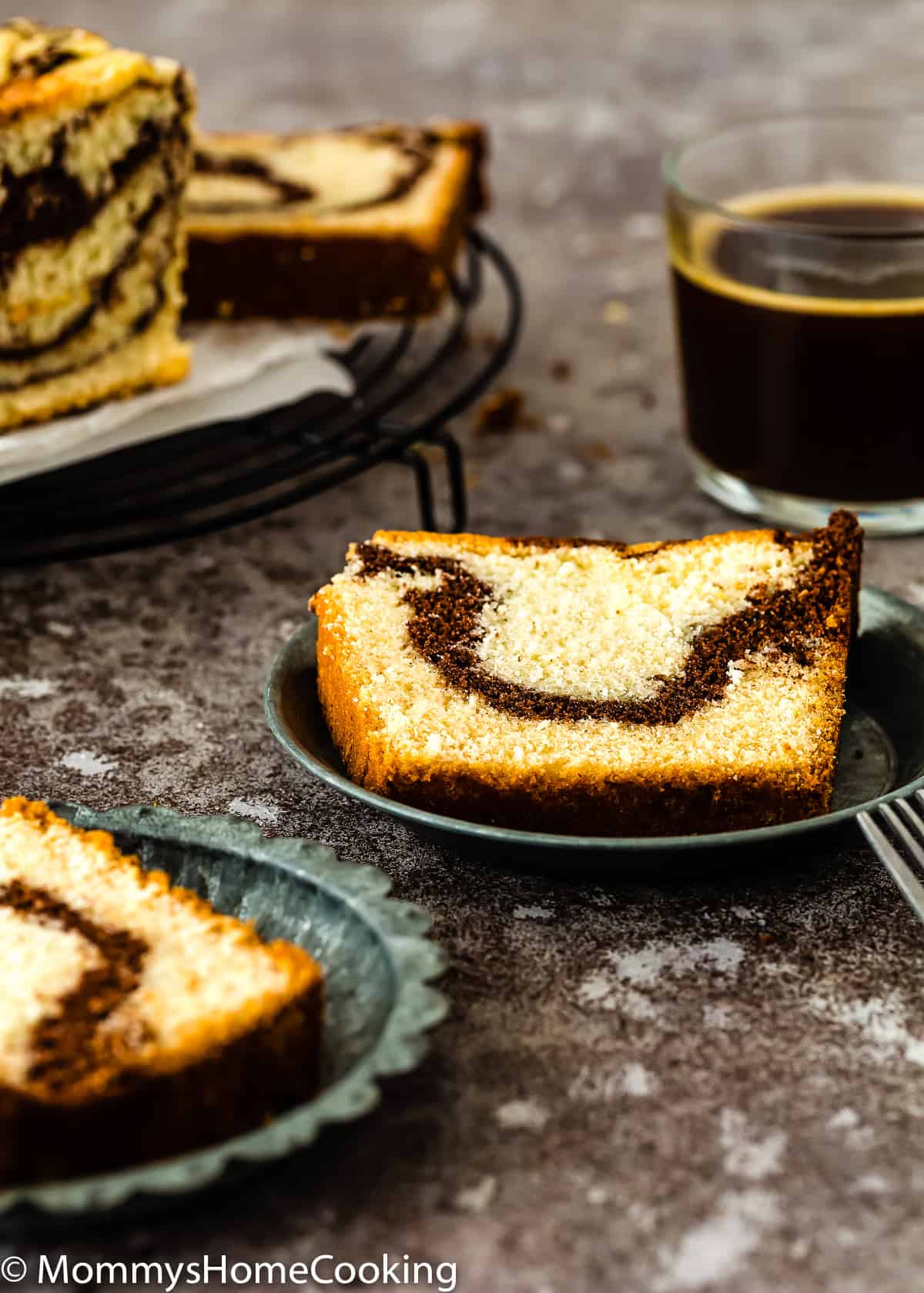 Eggless Marble Cake slices over little metal plates