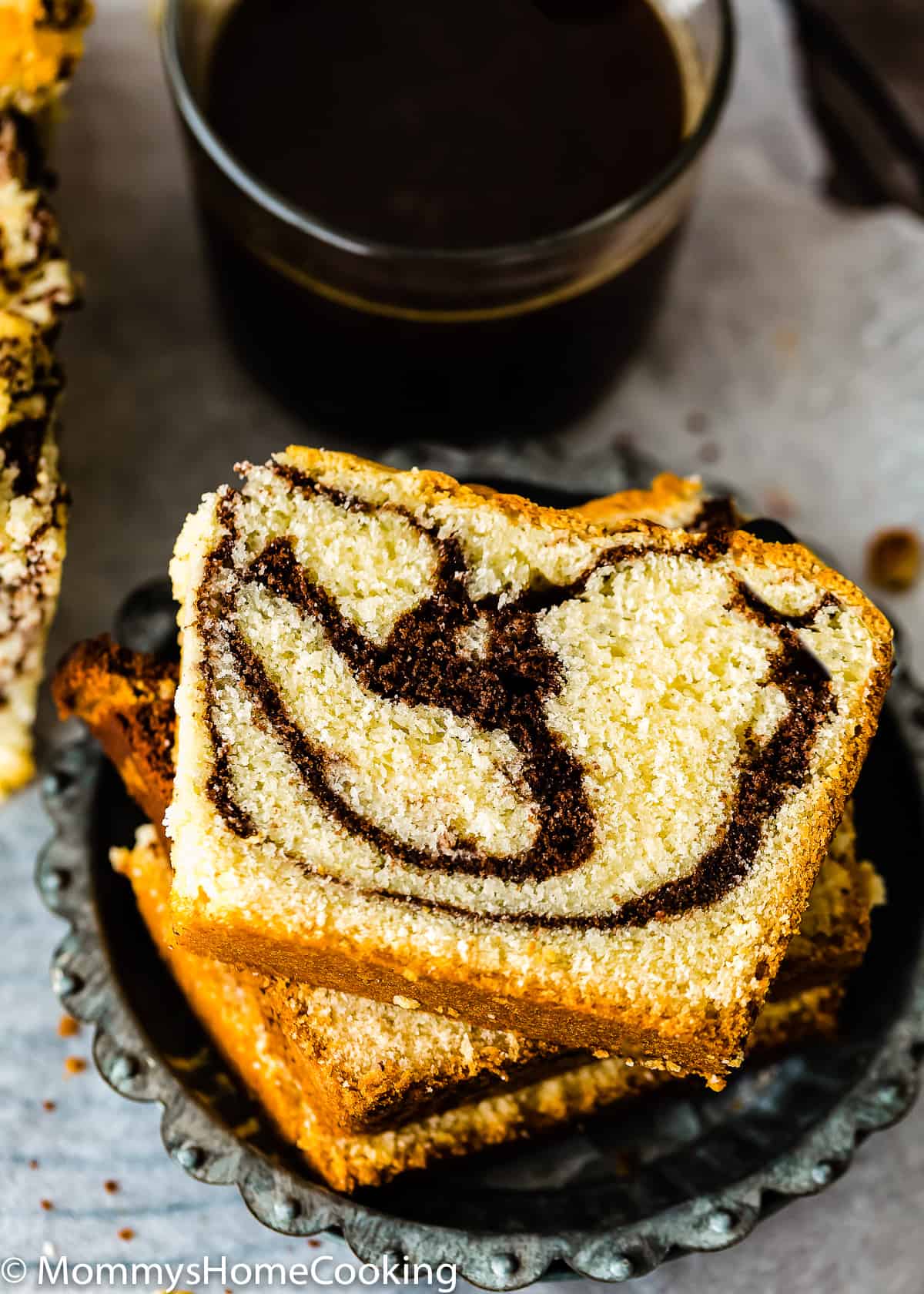 closeup view of Eggless Marble Cake loaf slices.