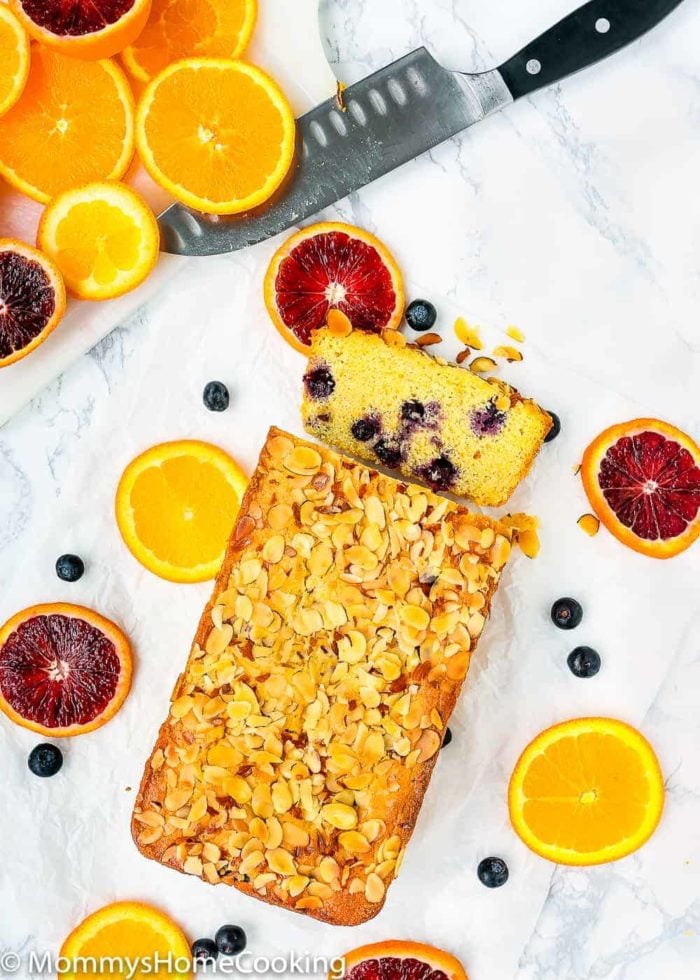 Sweet Eggless Orange Blueberry Corn Bread loaded with blueberries and sprinkled with almonds. The corn-citrus combination is so yummy and perfect for breakfast or snack time. Totally irresistible! https://mommyshomecooking.com