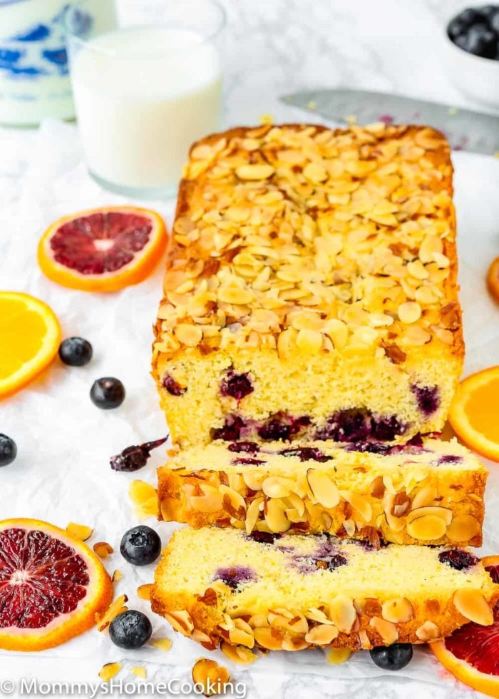 Sweet Eggless Orange Blueberry Corn Bread loaded with blueberries and sprinkled with almonds. The corn-citrus combination is so yummy and perfect for breakfast or snack time. Totally irresistible! https://mommyshomecooking.com